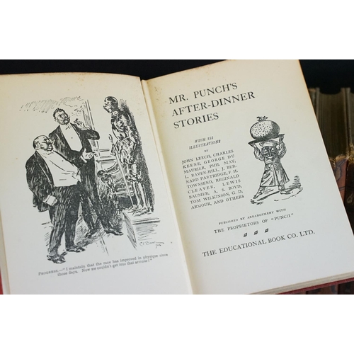 131 - Set of 25 ' Punch Library of Humour ' books, housed on a wooden book trough, approx 64cm wide