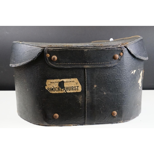 159 - Early 20th Century Henry Heath collapsible top hat together with a leather bound travel case with bl... 