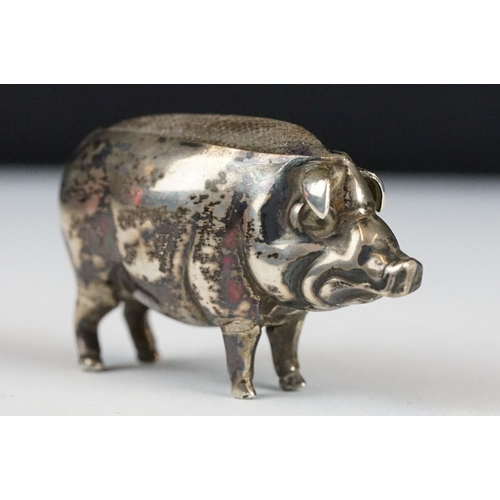 267 - An early 20th century fully hallmarked sterling silver pin cushion in the form of a pig, assay marke... 