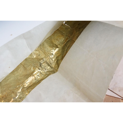 280 - A Quantity of gold leaf contained within paper envelopes.