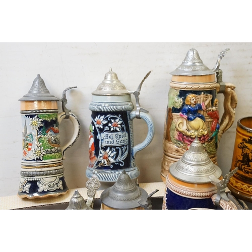 99 - Collection of assorted German beer steins to include musical examples. Tallest measures 27cm tall. T... 