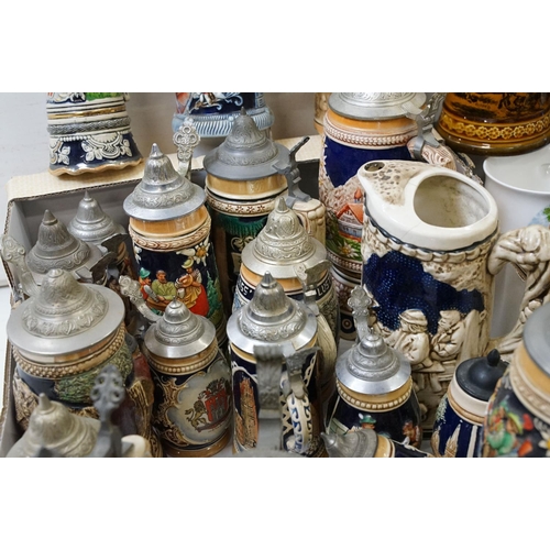 99 - Collection of assorted German beer steins to include musical examples. Tallest measures 27cm tall. T... 