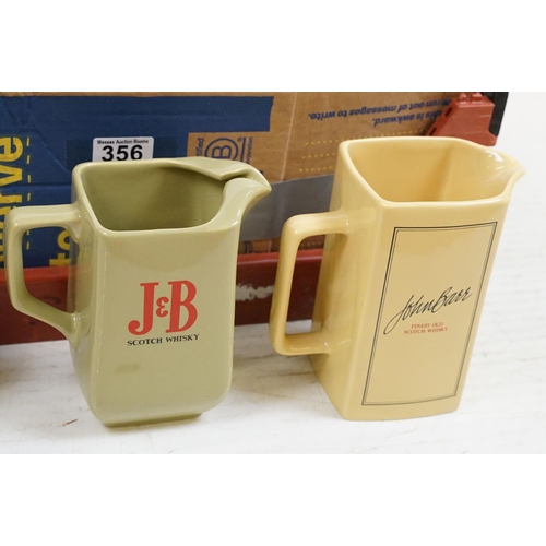 356 - Advertising - A collection of 24 ceramic water jugs, mainly Scotch whisky examples, featuring Cheque... 