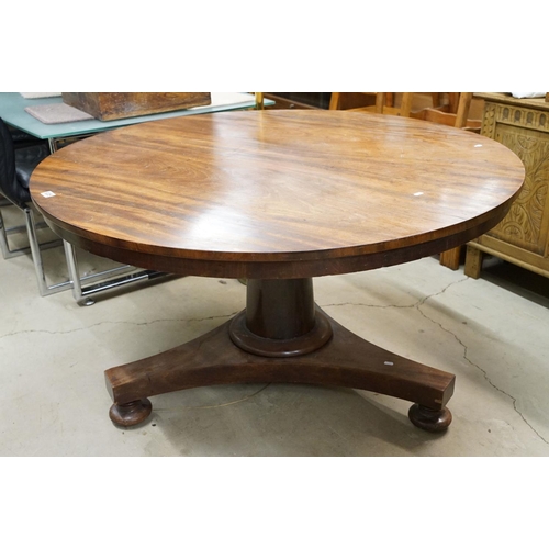 635 - 19th century Flamed Mahogany Circular Tilt Top Breakfast Table raised on a plain turned pillar suppo... 