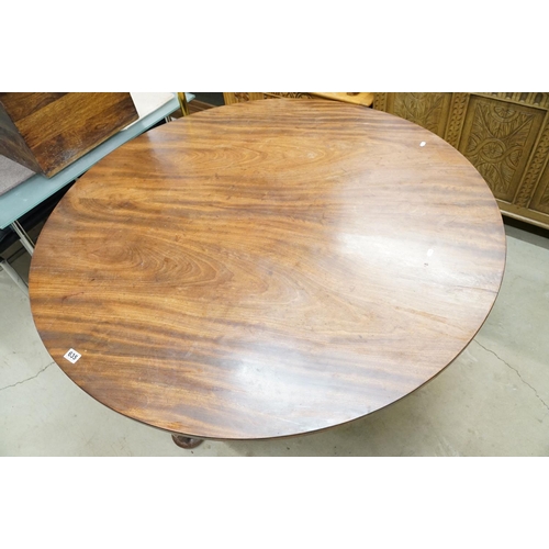 635 - 19th century Flamed Mahogany Circular Tilt Top Breakfast Table raised on a plain turned pillar suppo... 