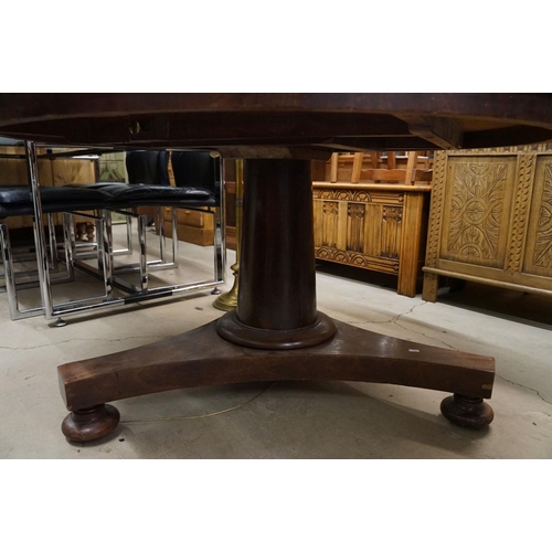 635 - 19th century Flamed Mahogany Circular Tilt Top Breakfast Table raised on a plain turned pillar suppo... 