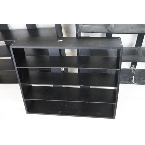 668 - Three Stained Black Wooden Wall Hanging Collector's Shelves, largest 64cm high x 60cm wide x 15cm de... 