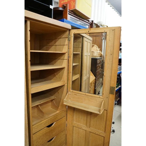 669 - Arts and Crafts ' Heal and Son ' Limed Oak Wardrobe, the two panel doors opening to an interior fitt... 