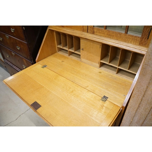 670 - Arts and Crafts ' Heal & Son ' Oak Bureau Bookcase, the upper section with two glazed doors opening ... 