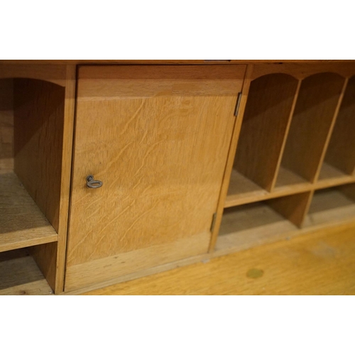 670 - Arts and Crafts ' Heal & Son ' Oak Bureau Bookcase, the upper section with two glazed doors opening ... 