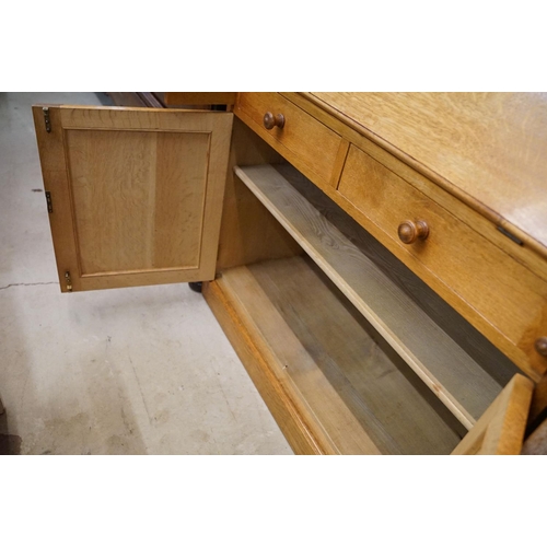 670 - Arts and Crafts ' Heal & Son ' Oak Bureau Bookcase, the upper section with two glazed doors opening ... 