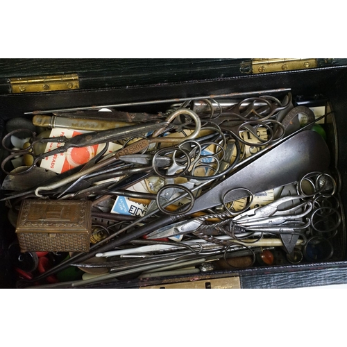 296 - A collection of early 20th century scissors and sewing items together with a mother of pearl manicur... 