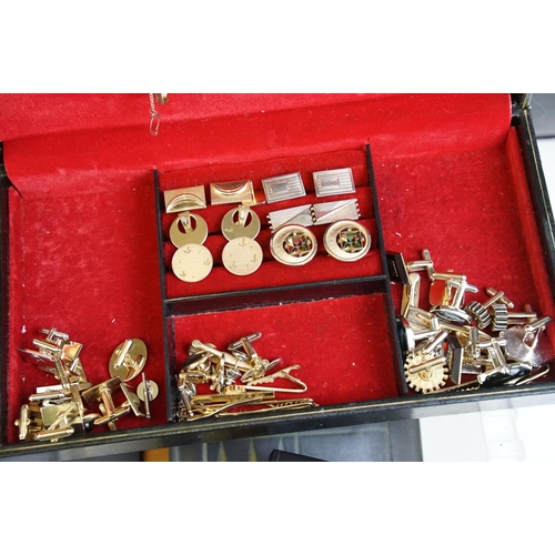 305 - A large collection of gents cufflinks, tie pins and tie clips.