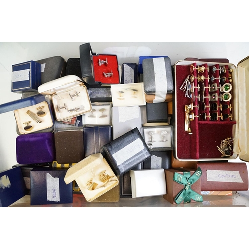 305 - A large collection of gents cufflinks, tie pins and tie clips.