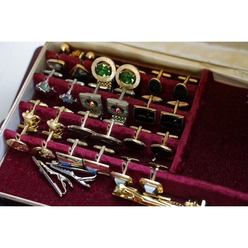 305 - A large collection of gents cufflinks, tie pins and tie clips.