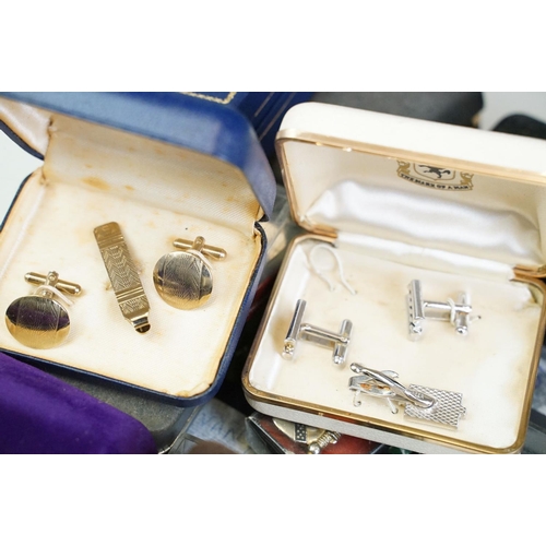 305 - A large collection of gents cufflinks, tie pins and tie clips.