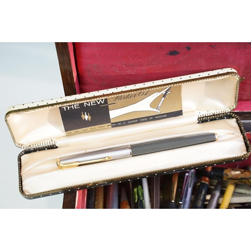 310 - A collection of mixed pens and pencils to include Parker & Waterman fountain pens together with othe... 