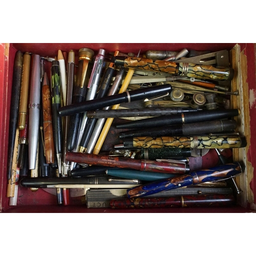 310 - A collection of mixed pens and pencils to include Parker & Waterman fountain pens together with othe... 