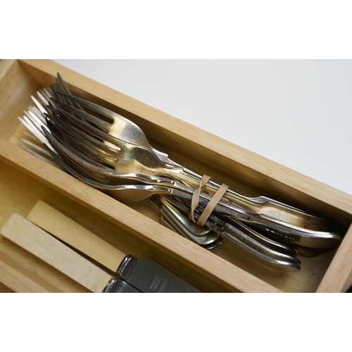 319 - A collection of mixed silver plated cutlery contained within two boxes