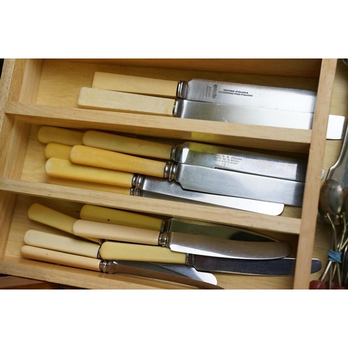 319 - A collection of mixed silver plated cutlery contained within two boxes