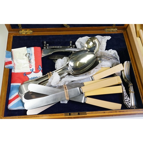 319 - A collection of mixed silver plated cutlery contained within two boxes