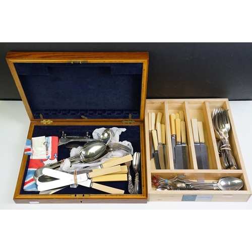 319 - A collection of mixed silver plated cutlery contained within two boxes