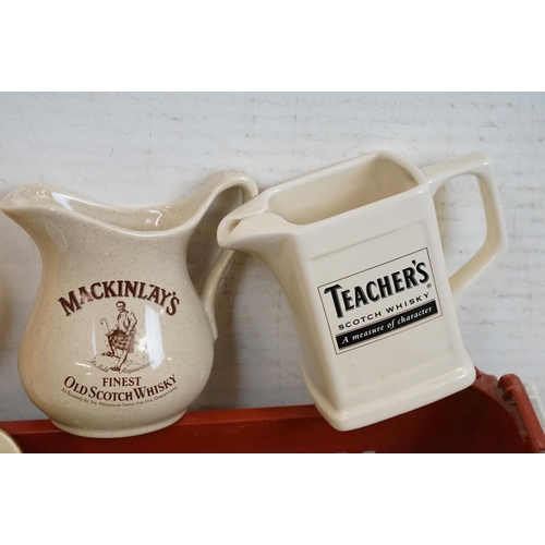 358 - Advertising - A collection of 20 advertising water jugs to include whisky examples, featuring 100 Pi... 