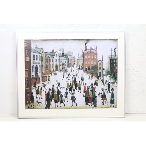 479 - After L S Lowry, a gallery framed print titled ' A Village Square ', label on verso, 45cm x 59.5cm, ... 