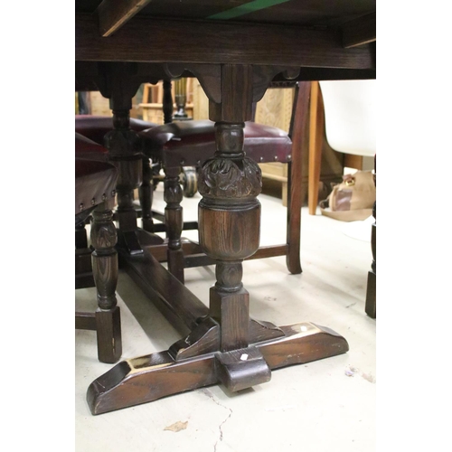 637 - Jacobean Revival Oak Draw-leaf Table raised on carved cup and cover supports united by a cross-stret... 