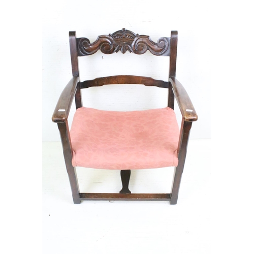 645 - Early 20th century Low Elbow Chair, the top rail carved with a crown and scrolls, 73cm high x 56cm w... 