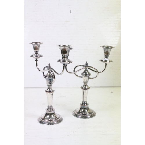 341 - A ceramic oriental style table lamp together with two silver plated candlesticks.