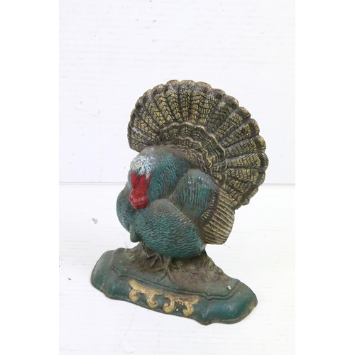 382 - Two painted cast iron doorstops to include a doorstop modelled as a turkey and another modelled as a... 