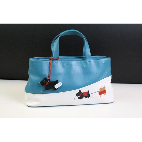 391 - Radley ' Explorer ' picture bag featuring a scotty dog pulling a trolley in the snow, complete with ... 