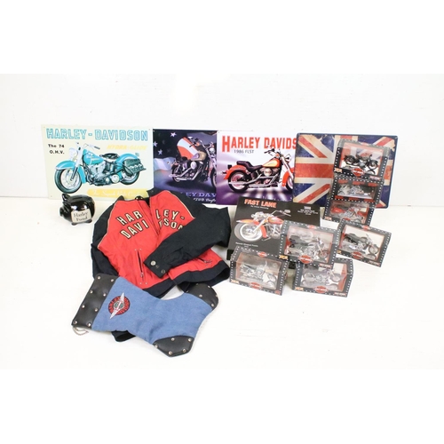 398 - A group of Harley Davidson Motorcycle collectables to include Maisto models, tin plate signs, money ... 