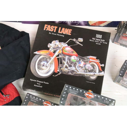 398 - A group of Harley Davidson Motorcycle collectables to include Maisto models, tin plate signs, money ... 