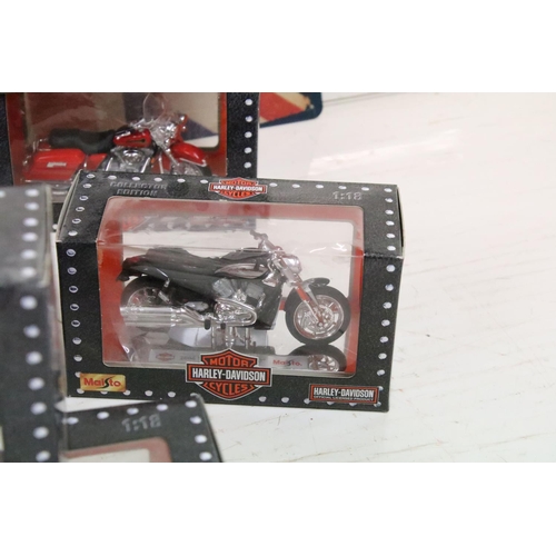 398 - A group of Harley Davidson Motorcycle collectables to include Maisto models, tin plate signs, money ... 