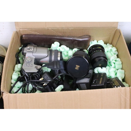 403 - A collection of mixed photography equipment to include camera's, lenses, video camera and various ac... 