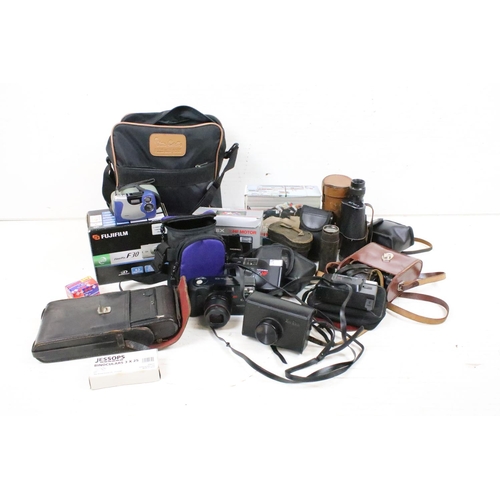 405 - A collection of mixed photographic equipment to include film and digital camera's together with bino... 