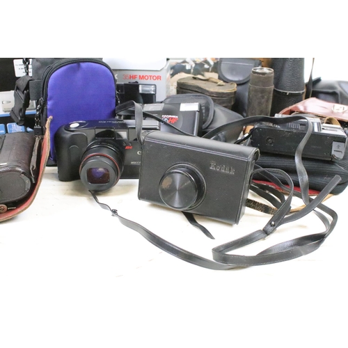 405 - A collection of mixed photographic equipment to include film and digital camera's together with bino... 