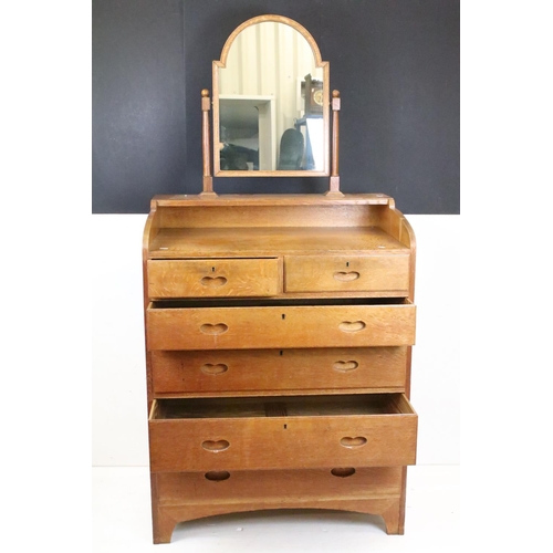 605 - Arts and Crafts Chestnut Dressing Chest with swing mirror over a chest of two short and four long dr... 