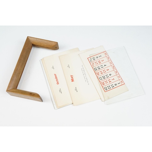 143 - Art Deco Perpetual Calendar set within a Wooden Frame, 17cm wide