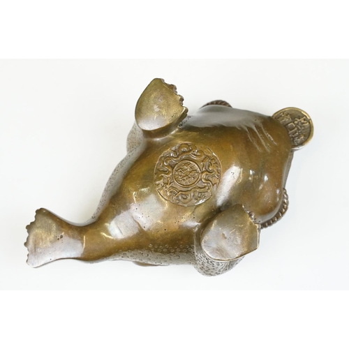 148 - Cast metal Chinese lucky money toad modelled with three legs with moulded detailing and coin to the ... 