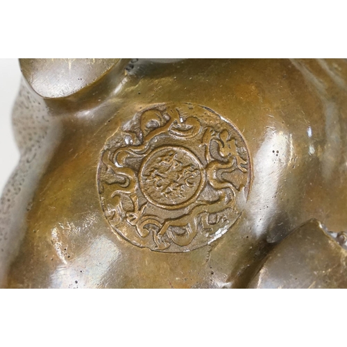 148 - Cast metal Chinese lucky money toad modelled with three legs with moulded detailing and coin to the ... 