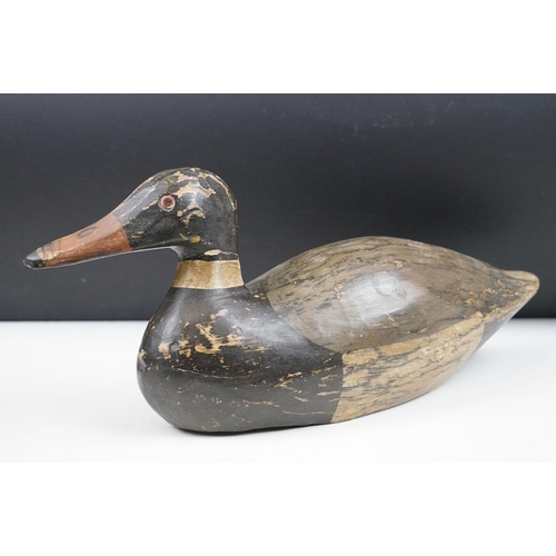 157 - Two early 20th Century carved and hand painted decoy ducks. Both unmarked, with flat bases. Measures... 