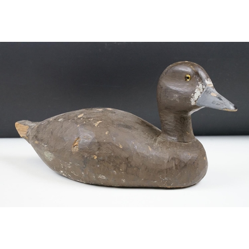 157 - Two early 20th Century carved and hand painted decoy ducks. Both unmarked, with flat bases. Measures... 