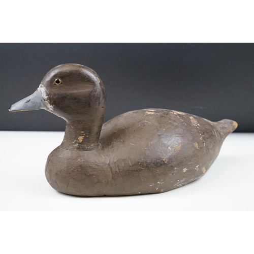 157 - Two early 20th Century carved and hand painted decoy ducks. Both unmarked, with flat bases. Measures... 