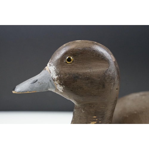 157 - Two early 20th Century carved and hand painted decoy ducks. Both unmarked, with flat bases. Measures... 