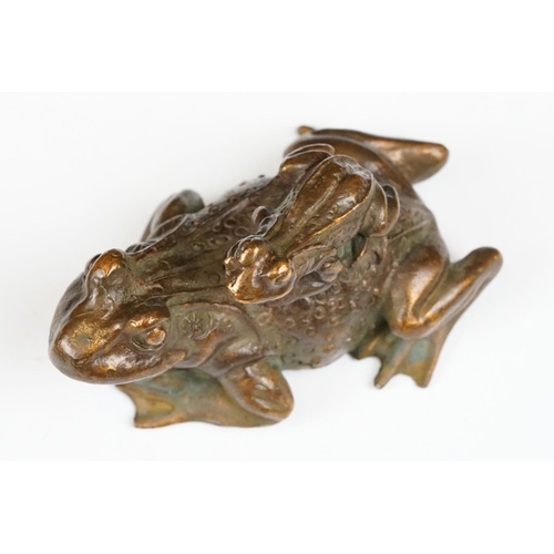 204 - An ornamental Chinese copper figure of a toad carrying a smalller toad.