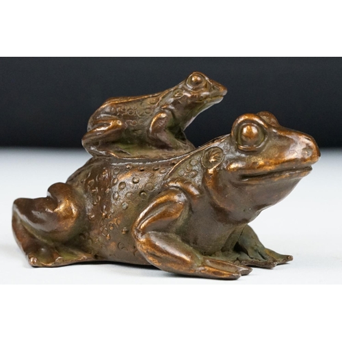 204 - An ornamental Chinese copper figure of a toad carrying a smalller toad.