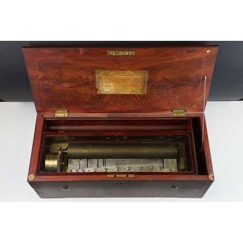 135 - 19th Century Six-air Swiss music box, the marquetry inlaid rosewood case opening to a 34.5cm brass c... 